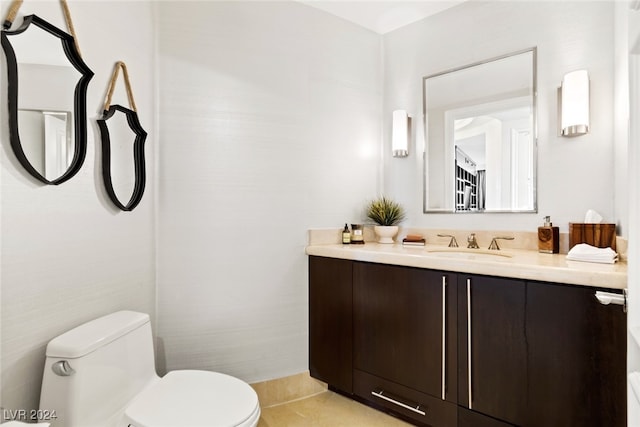 bathroom featuring vanity, toilet, and tile patterned floors