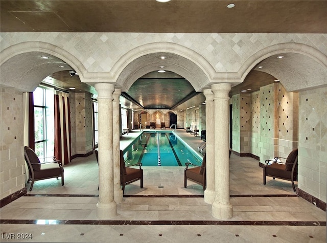 view of pool with decorative columns