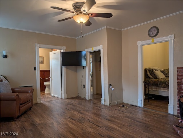 bedroom with crown molding, ensuite bathroom, dark wood-type flooring, and ceiling fan