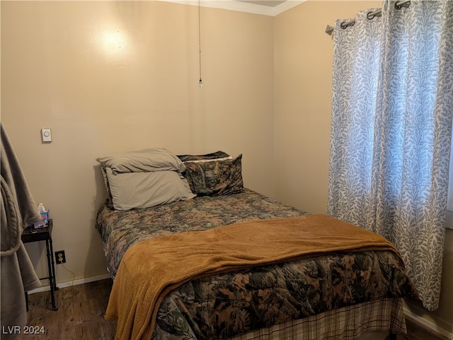 bedroom featuring dark hardwood / wood-style floors