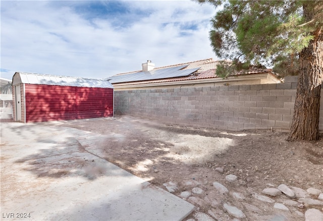 exterior space featuring a storage unit