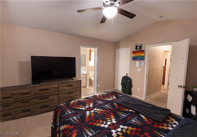 bedroom featuring ceiling fan, lofted ceiling, light colored carpet, and ensuite bathroom