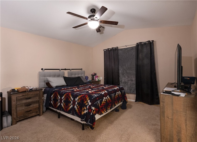 bedroom with ceiling fan, light carpet, and vaulted ceiling