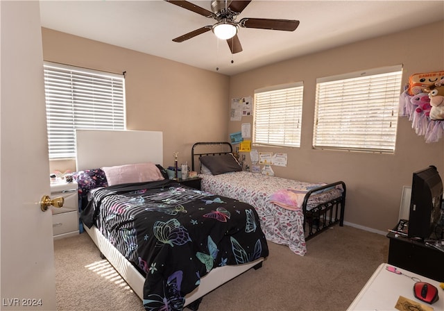 bedroom featuring ceiling fan and light colored carpet