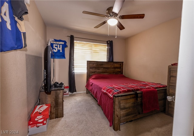 bedroom featuring ceiling fan and light colored carpet