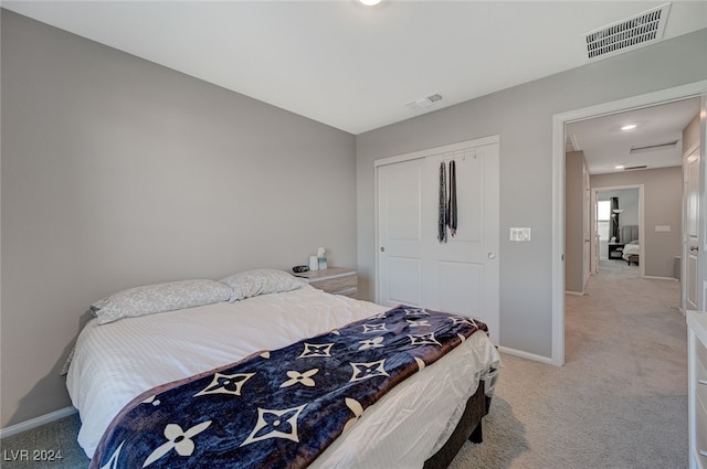 carpeted bedroom with a closet