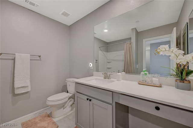 bathroom with toilet, vanity, tile patterned floors, and a shower with shower curtain