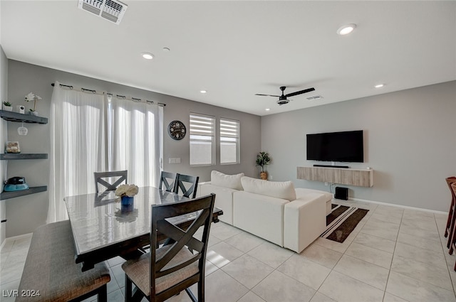 living room featuring ceiling fan and light tile patterned floors