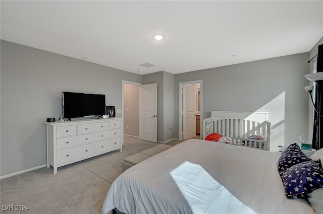 bedroom featuring light colored carpet