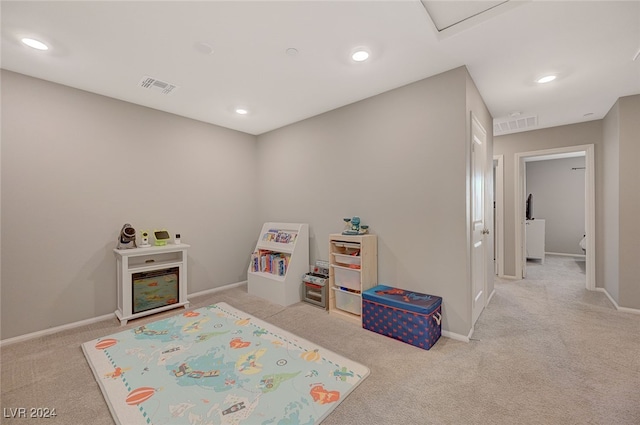 playroom featuring light colored carpet