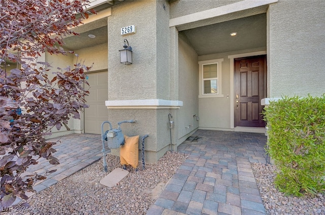 entrance to property featuring a garage