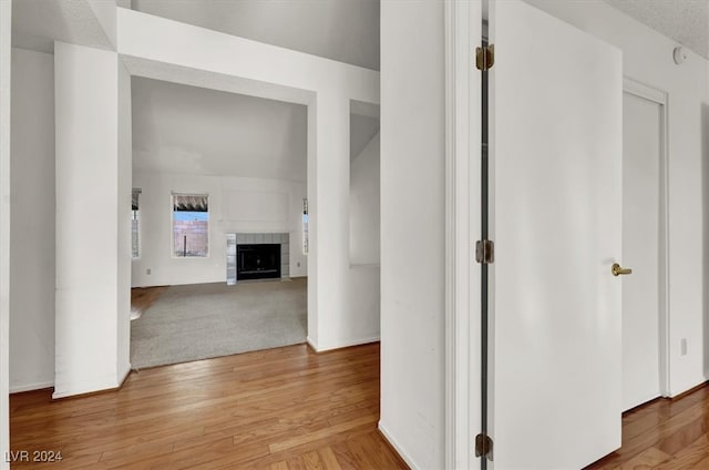 corridor with light hardwood / wood-style flooring