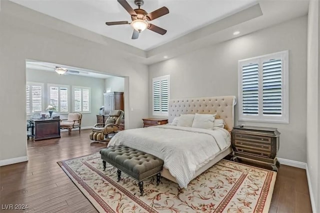 bedroom featuring ceiling fan and dark wood-type flooring