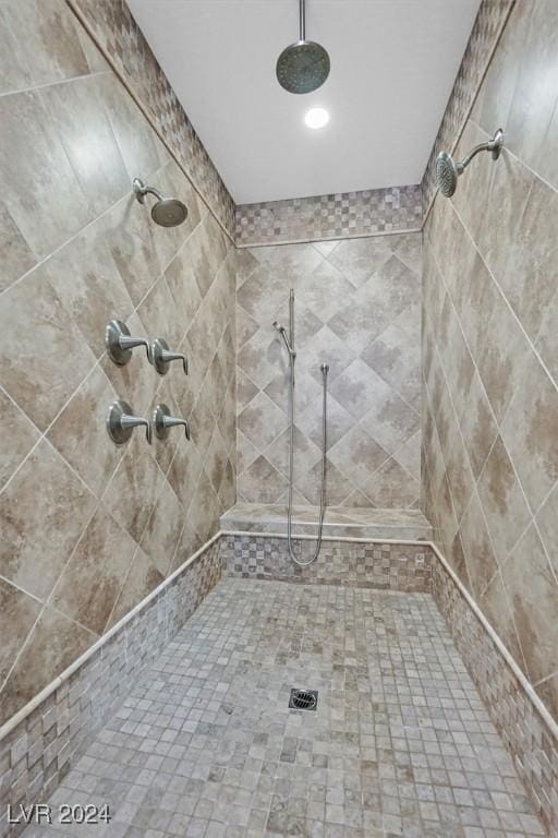 bathroom featuring a tile shower