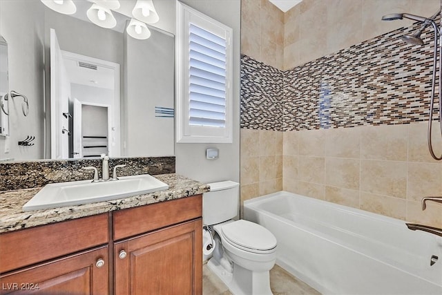 full bathroom featuring vanity, toilet, and tiled shower / bath combo