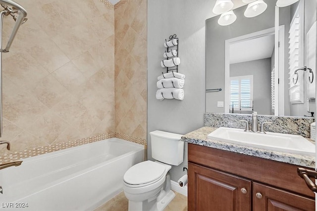 full bathroom with vanity, toilet, and tiled shower / bath