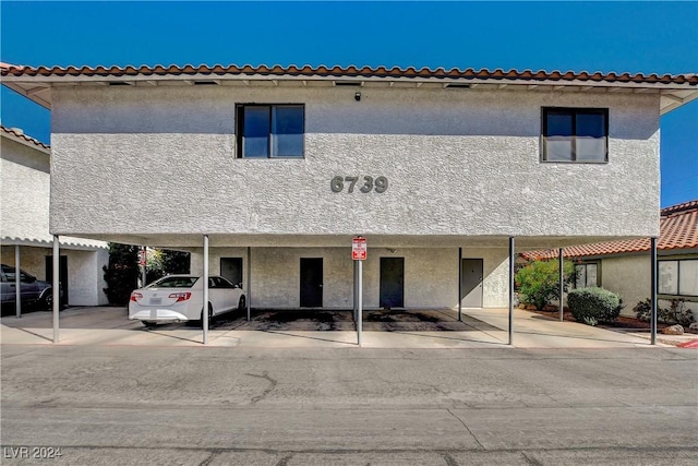 view of front of property with a carport