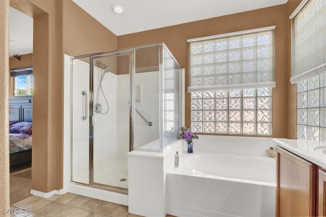 bathroom with vanity, independent shower and bath, and tile patterned flooring