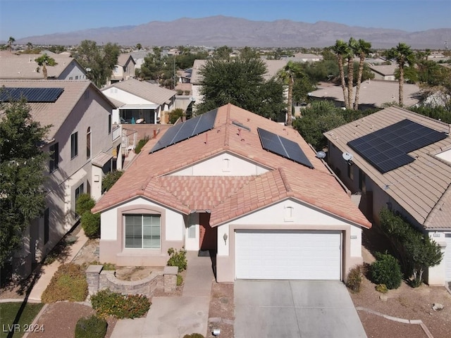 birds eye view of property with a mountain view