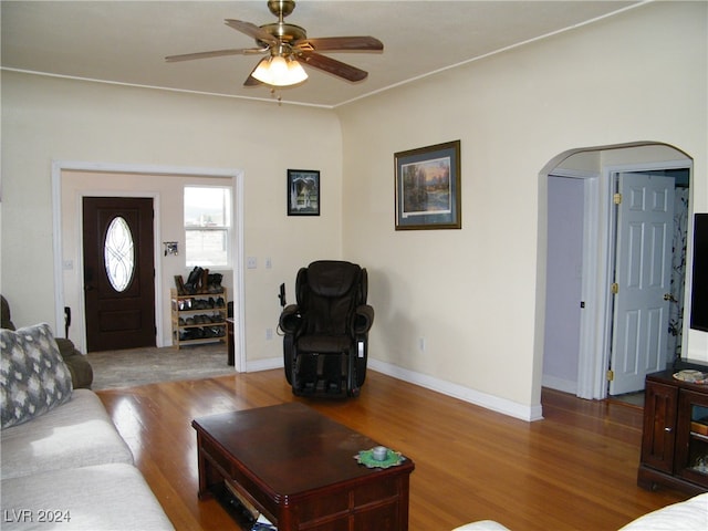 living room with ceiling fan and wood-type flooring