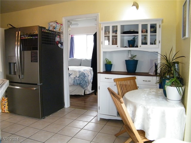 dining area featuring light tile patterned floors