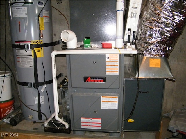 utility room featuring water heater