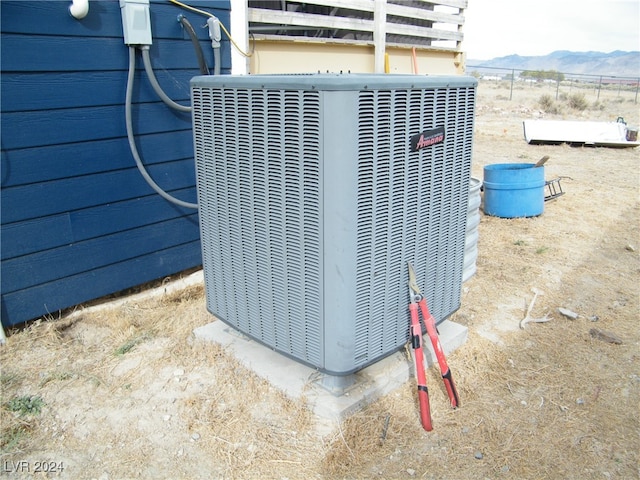 exterior details featuring a mountain view and central AC unit