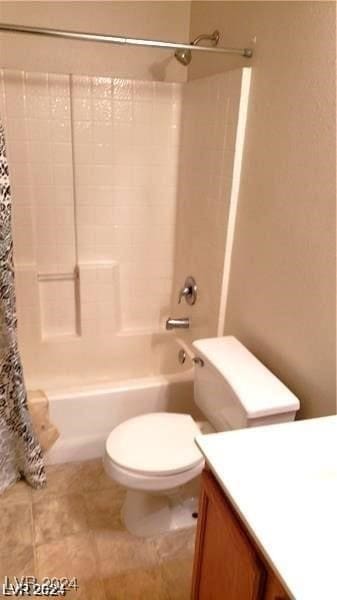 full bathroom with shower / tub combo, vanity, and toilet