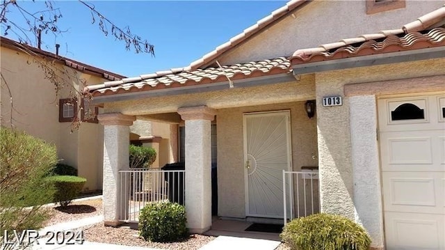 property entrance with a garage