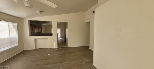 unfurnished room featuring ceiling fan and dark hardwood / wood-style floors