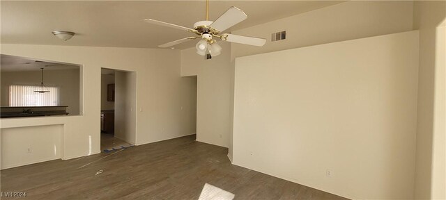 unfurnished living room with lofted ceiling, dark wood-type flooring, and ceiling fan