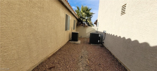 view of side of home with cooling unit