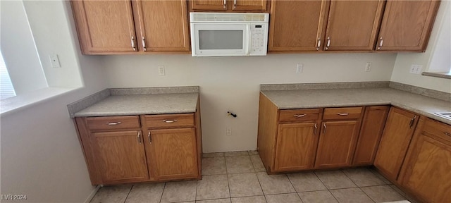 kitchen with light tile patterned floors