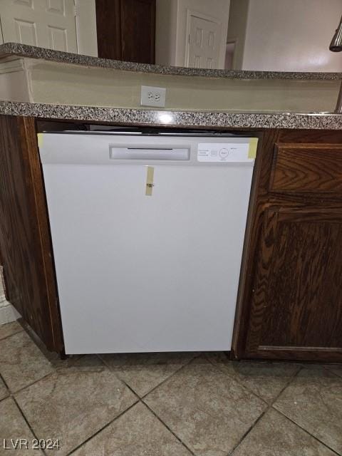 interior details featuring dishwasher and dark brown cabinets