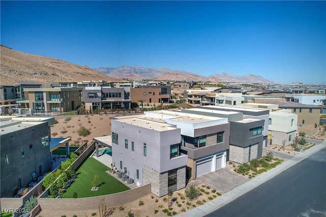 drone / aerial view with a residential view and a mountain view