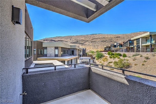 balcony featuring a mountain view