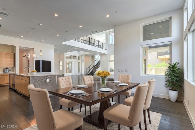 dining area with stairs, baseboards, dark wood-type flooring, and recessed lighting