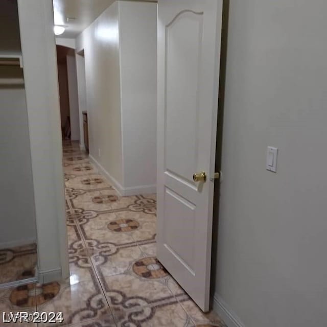 hallway with light tile patterned floors