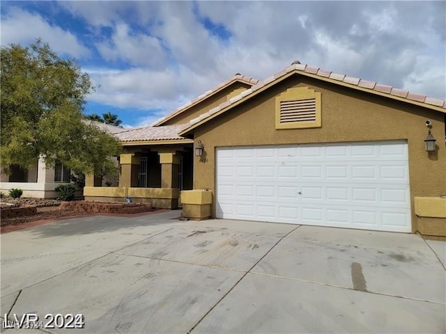 single story home with a garage