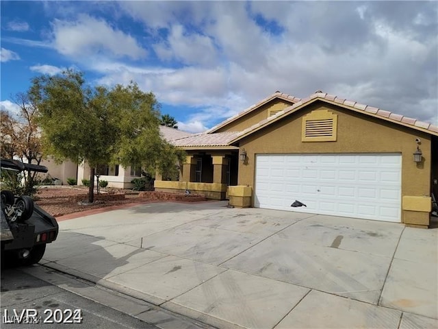 ranch-style house featuring a garage