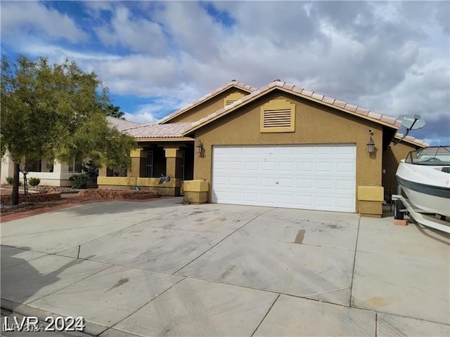 ranch-style home with a garage