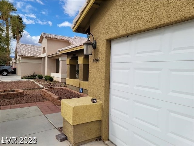 view of side of property featuring a garage