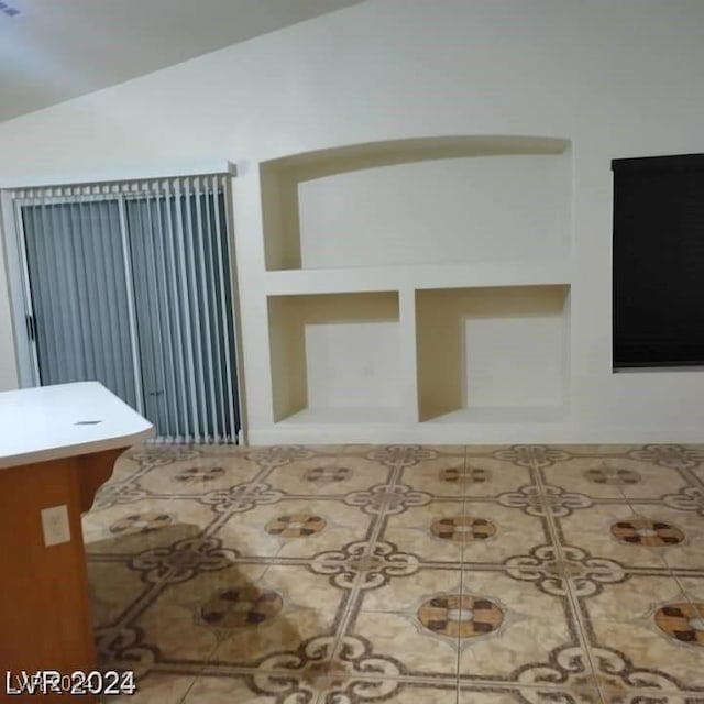 bedroom featuring lofted ceiling