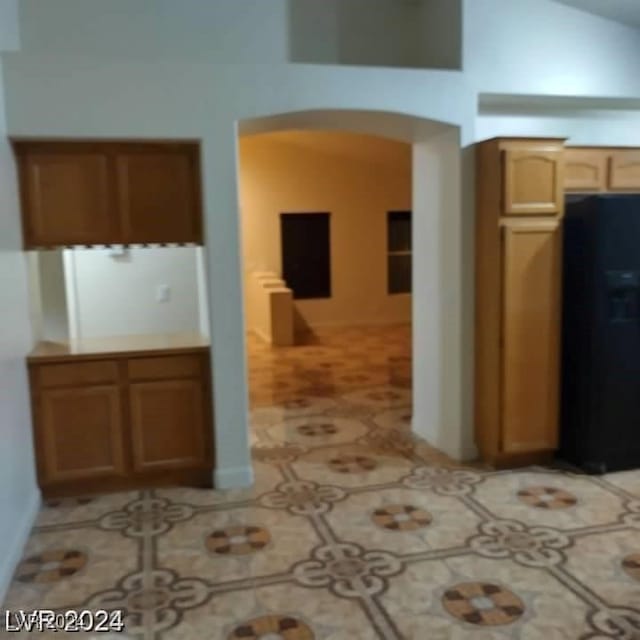 kitchen featuring black fridge