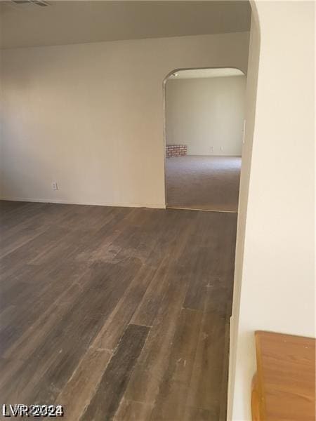 spare room featuring dark hardwood / wood-style flooring