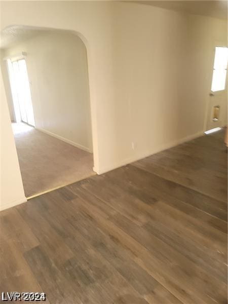 spare room featuring dark hardwood / wood-style floors