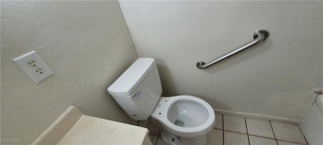 bathroom featuring tile patterned floors and toilet