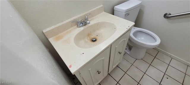 bathroom with vanity, tile patterned flooring, and toilet