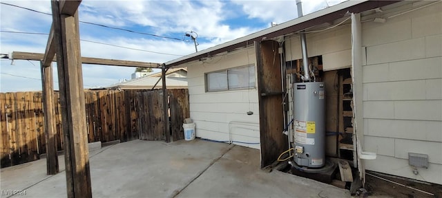 view of side of property with gas water heater