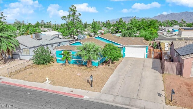 view of front of property featuring a mountain view and a garage